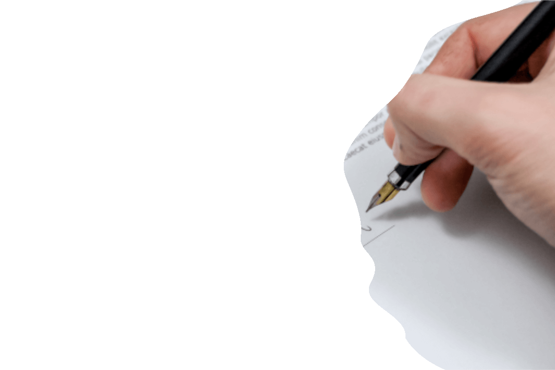 A pen writing on a piece of paper.